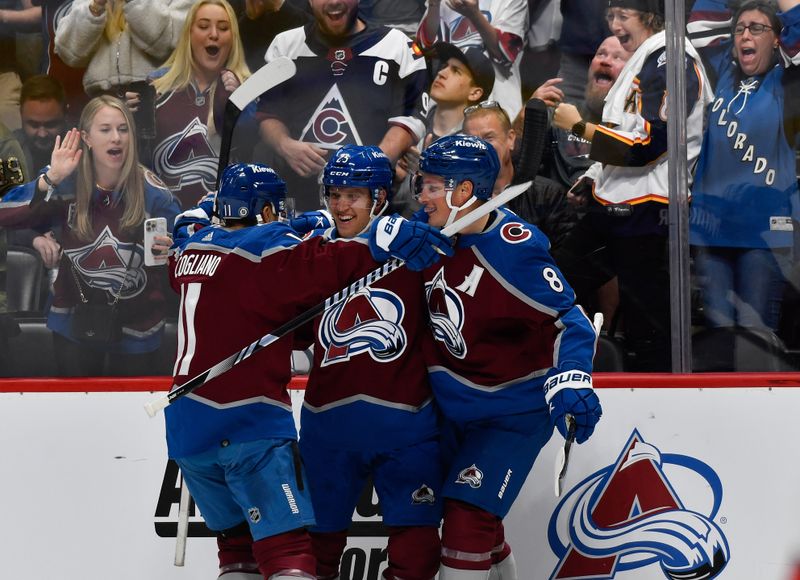 Oct 21, 2023; Denver, Colorado, USA;  Colorado Avalanche right wing Logan O'Connor (25) is congratulated by Colorado Avalanche center Andrew Cogliano (11) and Colorado Avalanche defenseman Cale Makar (8) after his short handed goal in the second period against the Carolina Hurricanes at Ball Arena. Mandatory Credit: John Leyba-USA TODAY Sports