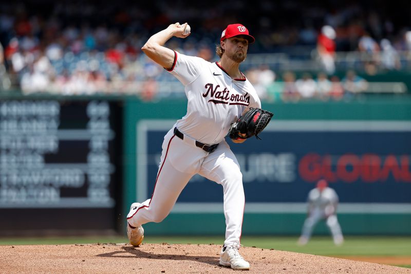 Jul 21, 2024; Washington, District of Columbia, USA; Washington Nationals starting pitcher Jake Irvin (27) pitches against the Cincinnati Reds during the first inning at Nationals Park. Mandatory Credit: Geoff Burke-USA TODAY Sports