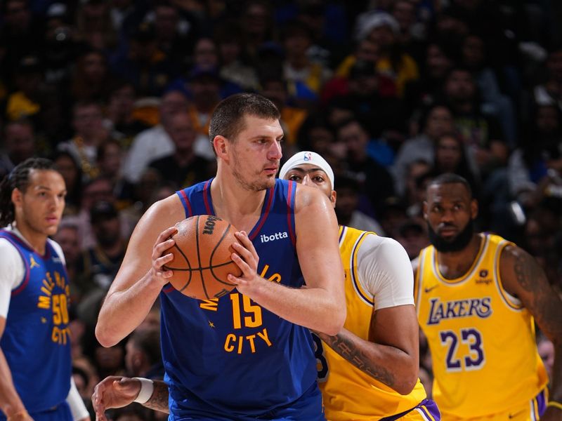 DENVER, CO - OCTOBER 24: Nikola Jokic #15 of the Denver Nuggets dribbles the ball during the game against the Los Angeles Lakers on October 24, 2023 at the Ball Arena in Denver, Colorado. NOTE TO USER: User expressly acknowledges and agrees that, by downloading and/or using this Photograph, user is consenting to the terms and conditions of the Getty Images License Agreement. Mandatory Copyright Notice: Copyright 2023 NBAE (Photo by Garrett Ellwood/NBAE via Getty Images)