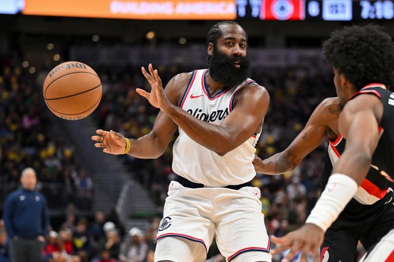 SEATTLE, WASHINGTON - OCTOBER 11: James Harden #1 of the LA Clippers passes the ball during the first quarter of the Rain City Showcase game against the Portland Trail Blazers at Climate Pledge Arena on October 11, 2024 in Seattle, Washington. The LA Clippers won 101-99. NOTE TO USER: User expressly acknowledges and agrees that, by downloading and or using this photograph, User is consenting to the terms and conditions of the Getty Images License Agreement. (Photo by Alika Jenner/Getty Images)