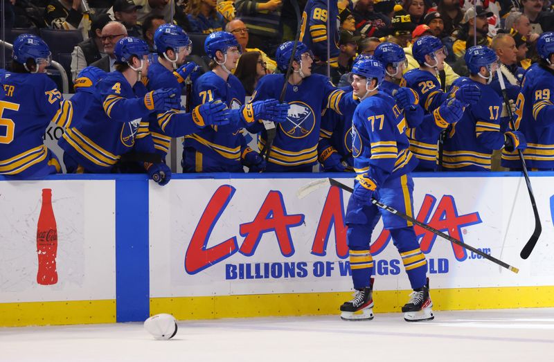 Jan 28, 2025; Buffalo, New York, USA;  Buffalo Sabres right wing JJ Peterka (77) celebrates his third goal of the game with teammates during the third period against the Boston Bruins at KeyBank Center. Mandatory Credit: Timothy T. Ludwig-Imagn Images