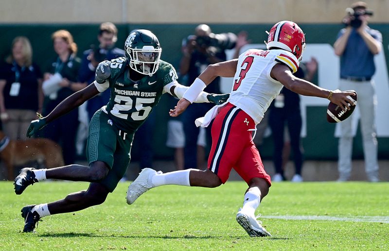 Sep 23, 2023; East Lansing, Michigan, USA;  Michigan State Spartans defensive back Chance Rucker (25) chases Maryland Terrapins quarterback Taulia Tagovailoa (3) out of the pocket in the first quarter at Spartan Stadium. Mandatory Credit: Dale Young-USA TODAY Sports