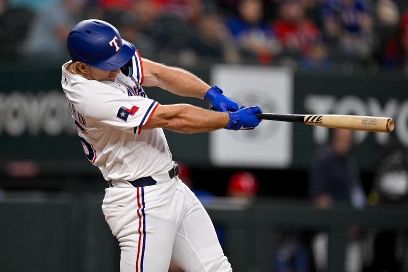 May 1, 2025; Arlington, Texas, USA; Texas Rangers left fielder Wyatt Langford (36) hits a single against the Athletics during the fourth inning at Globe Life Field. Mandatory Credit: Jerome Miron-Imagn Images