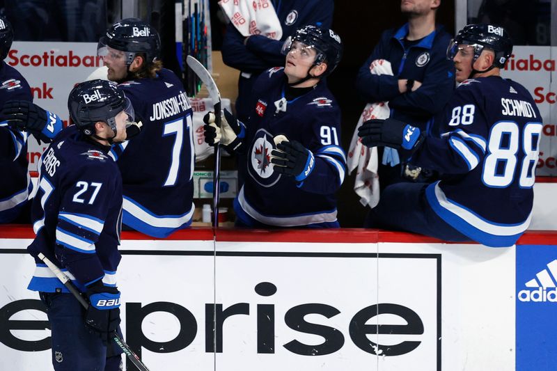 Jan 2, 2024; Winnipeg, Manitoba, CAN; Winnipeg Jets left wing Nikolaj Ehlers (27) celebrates his third period goal against the Tampa Bay Lightning at Canada Life Centre. Mandatory Credit: James Carey Lauder-USA TODAY Sports