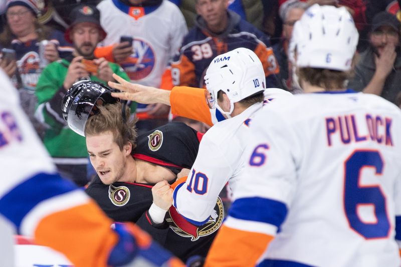 Mar 19, 2026; Ottawa, Ontario, CAN; Ottawa Senators center Ridly Greig (71) fights with New York Islanders center Brayden Schenn (10) in the first period at the Canadian Tire Centre. Mandatory Credit: Marc DesRosiers-IMAGN Images