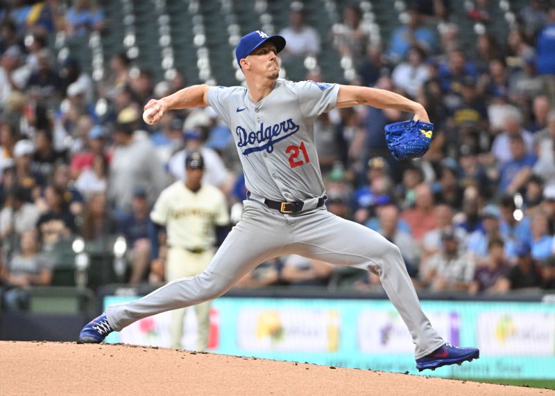 Aug 14, 2024; Milwaukee, Wisconsin, USA; Los Angeles Dodgers starting pitcher Walker Buehler (21) delivers a pitch against the Milwaukee Brewers in the first inning at American Family Field. Mandatory Credit: Michael McLoone-USA TODAY Sports