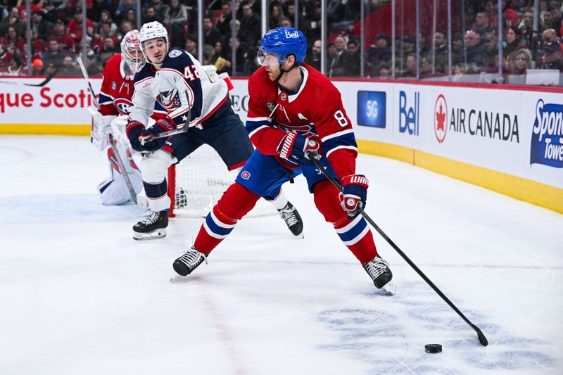 Mar 12, 2024; Montreal, Quebec, CAN; Montreal Canadiens defenseman Mike Matheson (8) defends the puck against Columbus Blue Jackets center Alexandre Texier (42) during the second period at Bell Centre. Mandatory Credit: David Kirouac-USA TODAY Sports