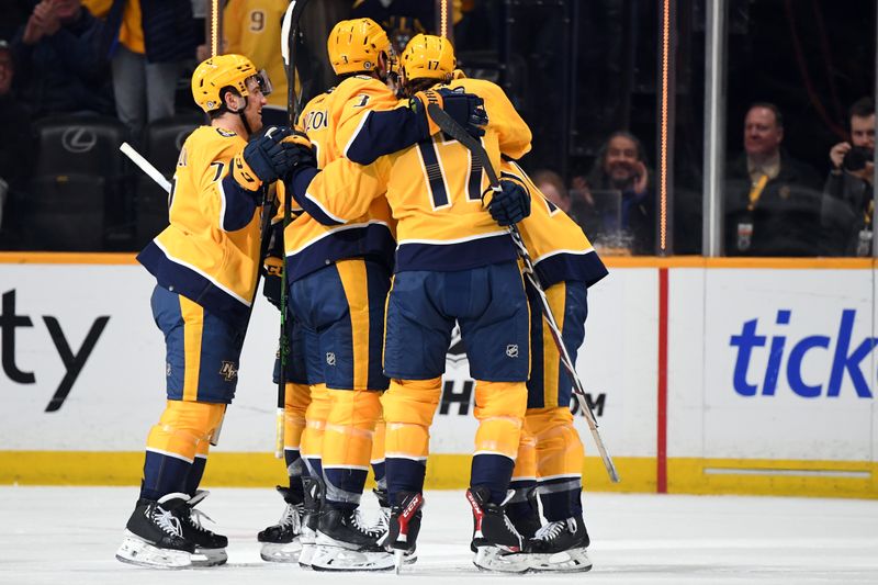 Mar 26, 2024; Nashville, Tennessee, USA; Nashville Predators players celebrate after a goal by center Mark Jankowski (17) during the second period against the Vegas Golden Knights at Bridgestone Arena. Mandatory Credit: Christopher Hanewinckel-USA TODAY Sports