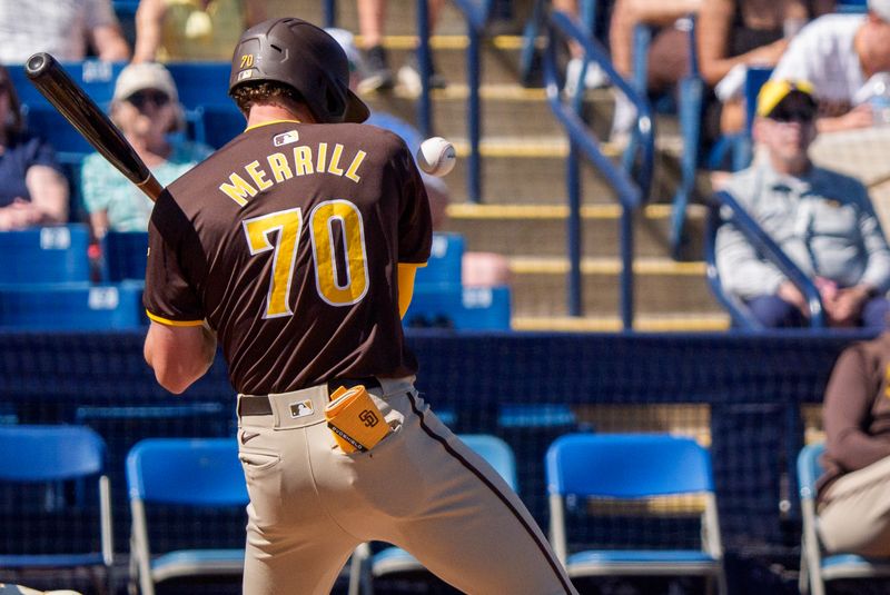 Mar 1, 2024; Phoenix, Arizona, USA;  San Diego Padres infielder Jackson Merrill (70) reacts just in time to avoid been hit in the first inning during a spring training game against the Milwaukee Brewers at American Family Fields of Phoenix. Mandatory Credit: Allan Henry-USA TODAY Sports