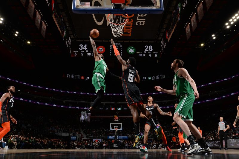 DETROIT, MI - MARCH 22: Oshae Brissett #12 of the Boston Celtics dunks the ball during the game against the Detroit Pistons on March 22, 2024 at Little Caesars Arena in Detroit, Michigan. NOTE TO USER: User expressly acknowledges and agrees that, by downloading and/or using this photograph, User is consenting to the terms and conditions of the Getty Images License Agreement. Mandatory Copyright Notice: Copyright 2024 NBAE (Photo by Chris Schwegler/NBAE via Getty Images)