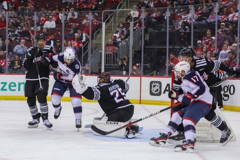 Mar 11, 2025; Newark, New Jersey, USA; New Jersey Devils goaltender Jacob Markstrom (25) makes a save against the Columbus Blue Jackets during the third period at Prudential Center. Mandatory Credit: Ed Mulholland-Imagn Images