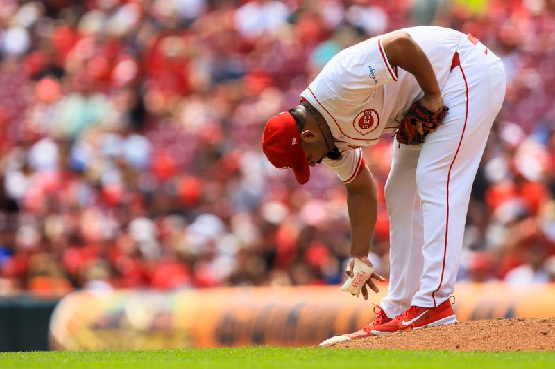 Aug 4, 2024; Cincinnati, Ohio, USA; Cincinnati Reds relief pitcher Tony Santillan (64) prepares to pitch in the seventh inning against the San Francisco Giants at Great American Ball Park. Mandatory Credit: Katie Stratman-USA TODAY Sports