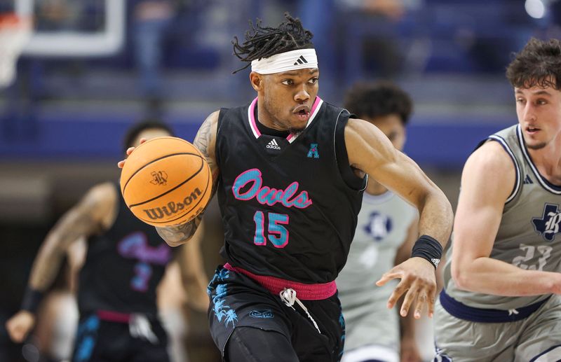 Jan 24, 2024; Houston, Texas, USA; Florida Atlantic Owls guard Alijah Martin (15) drives with the ball on a fast break during the second half against the Rice Owls at Tudor Fieldhouse. Mandatory Credit: Troy Taormina-USA TODAY Sports