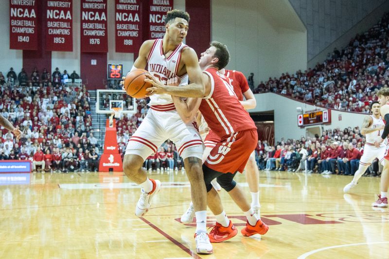 Jan 14, 2023; Bloomington, Indiana, USA; Indiana Hoosiers forward Trayce Jackson-Davis (23) shoots the ball while Wisconsin Badgers forward Carter Gilmore (14) defends in the first half at Simon Skjodt Assembly Hall. Mandatory Credit: Trevor Ruszkowski-USA TODAY Sports