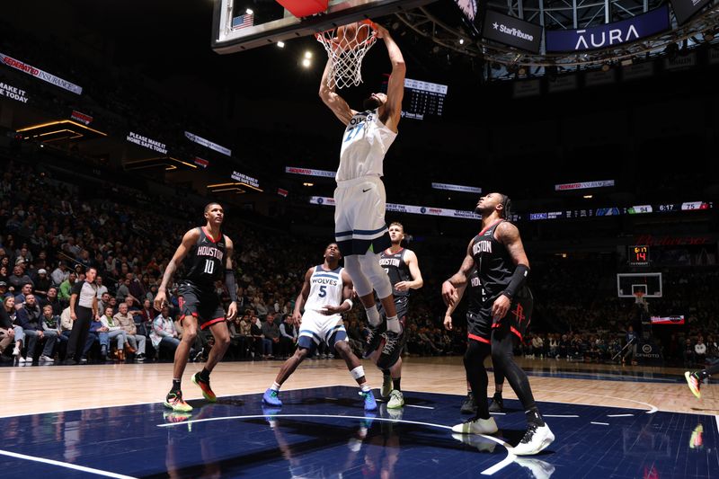 MINNEAPOLIS, MN -  FEBRUARY 4: Rudy Gobert #27 of the Minnesota Timberwolves dunks the ball during the game against the Houston Rockets on February 4, 2024 at Target Center in Minneapolis, Minnesota. NOTE TO USER: User expressly acknowledges and agrees that, by downloading and or using this Photograph, user is consenting to the terms and conditions of the Getty Images License Agreement. Mandatory Copyright Notice: Copyright 2024 NBAE (Photo by David Sherman/NBAE via Getty Images)