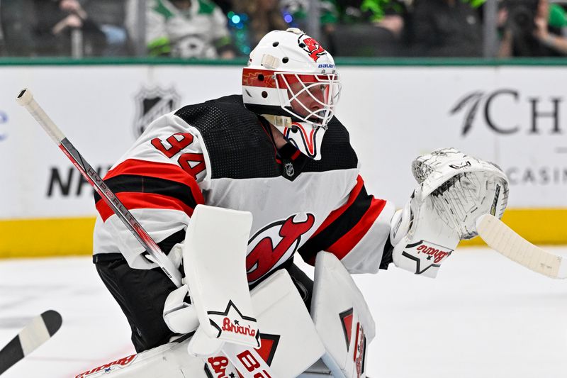 Mar 14, 2024; Dallas, Texas, USA; New Jersey Devils goaltender Jake Allen (34) faces the Dallas Stars attack during the second period at the American Airlines Center. Mandatory Credit: Jerome Miron-USA TODAY Sports