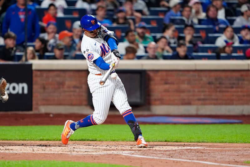 Sep 22, 2024; New York City, New York, USA; New York Mets third baseman Mark Vientos (27) hits a double against the Philadelphia Phillies during the second inning at Citi Field. Mandatory Credit: Gregory Fisher-Imagn Images