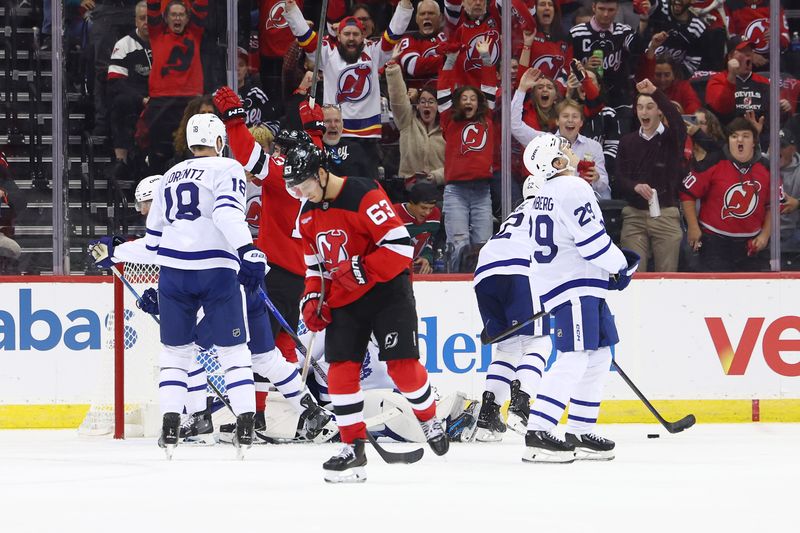 Oct 10, 2024; Newark, New Jersey, USA; New Jersey Devils left wing Jesper Bratt (63) celebrates his goal against the Toronto Maple Leafs during the first period at Prudential Center. Mandatory Credit: Ed Mulholland-Imagn Images