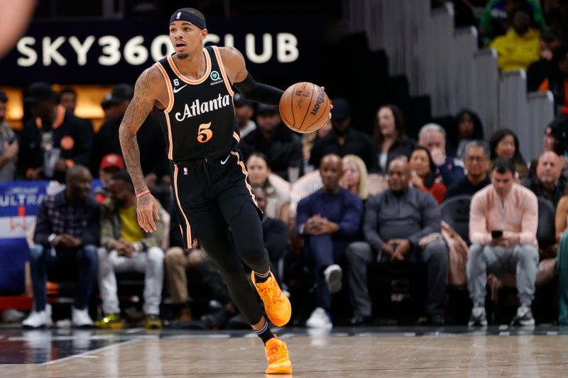 ATLANTA, GA - JANUARY 28: Dejounte Murray #5 of the Atlanta Hawks dribbles down court during the first half against the LA Clippers at State Farm Arena on January 28, 2023 in Atlanta, Georgia. NOTE TO USER: User expressly acknowledges and agrees that,  by downloading and or using this photograph,  User is consenting to the terms and conditions of the Getty Images License Agreement. (Photo by Alex Slitz/Getty Images)