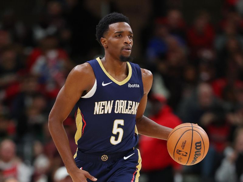 CHICAGO, ILLINOIS - DECEMBER 02: Herbert Jones #5 of the New Orleans Pelicans dribbles up the court against the Chicago Bulls during the second half at the United Center on December 02, 2023 in Chicago, Illinois. NOTE TO USER: User expressly acknowledges and agrees that, by downloading and or using this photograph, User is consenting to the terms and conditions of the Getty Images License Agreement.  (Photo by Michael Reaves/Getty Images)