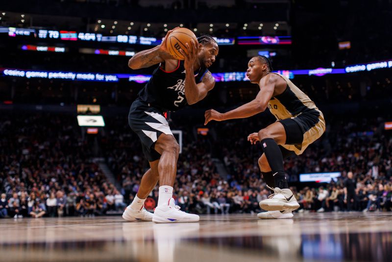 TORONTO, CANADA - JANUARY 26: Scottie Barnes #4 of the Toronto Raptors plays defence against Kawhi Leonard #2 of the LA Clippers during the second half of their NBA game at Scotiabank Arena on January 26, 2024 in Toronto, Canada. NOTE TO USER: User expressly acknowledges and agrees that, by downloading and or using this photograph, User is consenting to the terms and conditions of the Getty Images License Agreement. (Photo by Cole Burston/Getty Images)