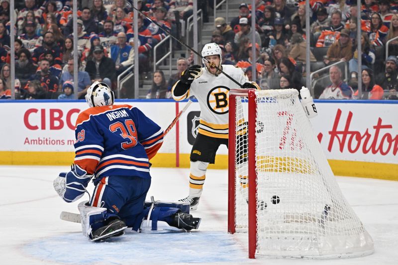 Dec 31, 2025; Edmonton, Alberta, CAN; Boston Bruins left winger Viktor Arvidsson (71) celebrates a goal in front of  Edmonton Oilers goalie Connor Ingram (39) in the second period at Rogers Place. Mandatory Credit: Walter Tychnowicz-Imagn Images
