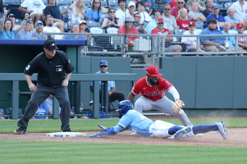 Jun 17, 2023; Kansas City, Missouri, USA; Kansas City Royals pinch runner Dairon Blanco (44) slides safely into third base as Los Angeles Angels third baseman Luis Rengifo (2) is late on the tag in the ninth inning at Kauffman Stadium. Mandatory Credit: Scott Sewell-USA TODAY Sports