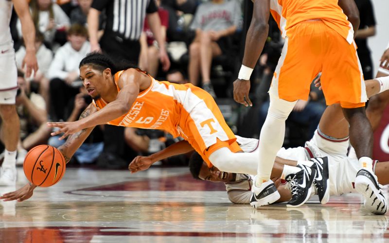 Mar 2, 2024; Tuscaloosa, Alabama, USA;  Tennessee guard Zakai Zeigler (5) dives for a loose ball with Alabama guard Rylan Griffen (3) at Coleman Coliseum. Mandatory Credit: Gary Cosby Jr.-USA TODAY Sports