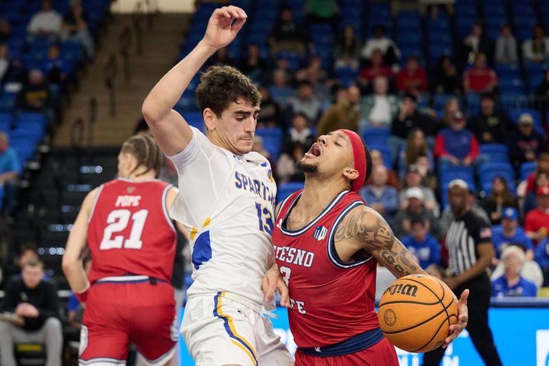 Feb 6, 2024; San Jose, California, USA; Fresno State Bulldogs guard Isaiah Hill (3) dribbles the ball against San Jose State Spartans guard Alvaro Cardenas (13) during the first half at Provident Credit Union Event Center. Mandatory Credit: Robert Edwards-USA TODAY Sports