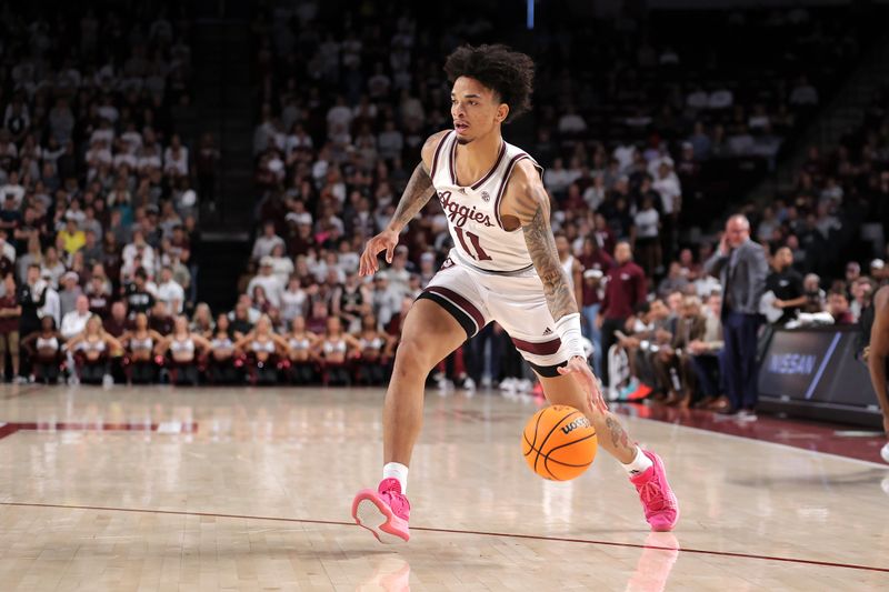 Dec 10, 2023; College Station, Texas, USA; Texas A&M Aggies forward Andersson Garcia (11) handles the ball against the Memphis Tigers defenders during the first half at Reed Arena. Mandatory Credit: Erik Williams-USA TODAY Sports