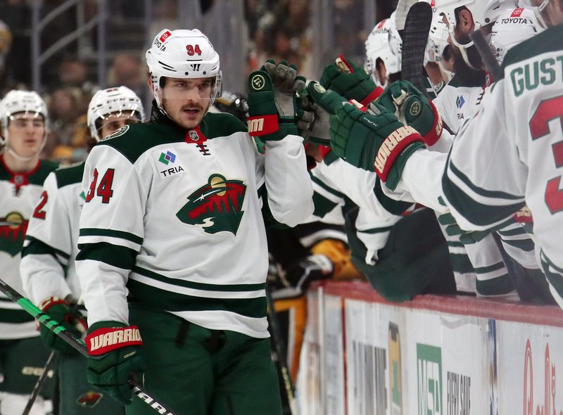 Oct 29, 2024; Pittsburgh, Pennsylvania, USA; Minnesota Wild center Jakub Lauko (94) celebrates his goal with the Wild bench against the Pittsburgh Penguins during the first period at PPG Paints Arena. Mandatory Credit: Charles LeClaire-Imagn Images