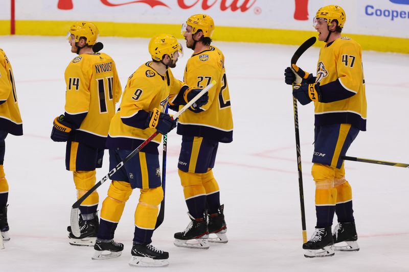 Mar 21, 2024; Sunrise, Florida, USA; Nashville Predators left wing Filip Forsberg (9) celebrates with teammates after the game against the Florida Panthers at Amerant Bank Arena. Mandatory Credit: Sam Navarro-USA TODAY Sports