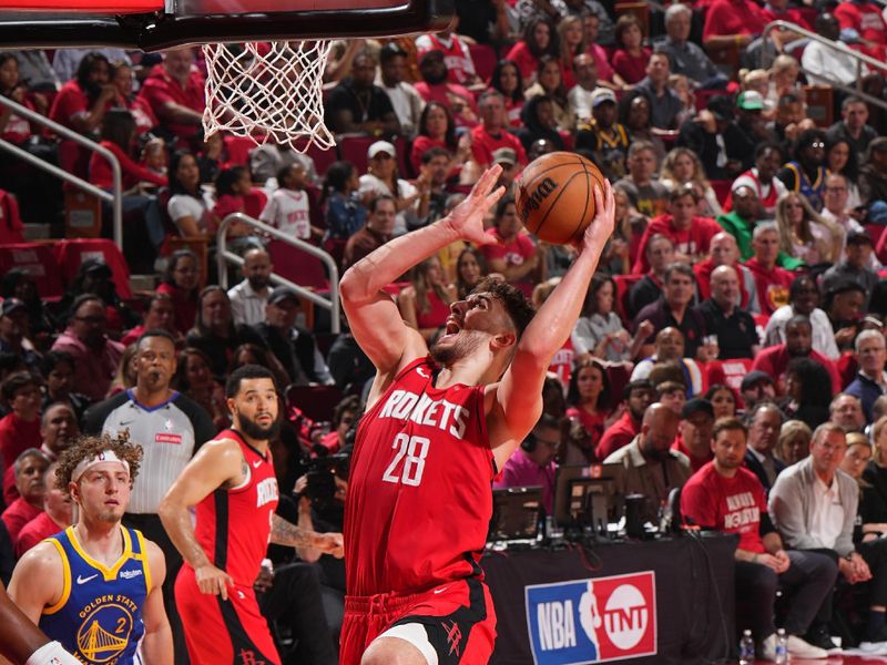 HOUSTON, TX - APRIL 30:   Alperen Sengun #28 of the Houston Rockets drives to the basket during the game against the Golden State Warriors  during Round 1 Game 5 of the 2025 NBA Playoffs   on April 30, 2025 at the Toyota Center in Houston, Texas. NOTE TO USER: User expressly acknowledges and agrees that, by downloading and or using this photograph, User is consenting to the terms and conditions of the Getty Images License Agreement. Mandatory Copyright Notice: Copyright 2025 NBAE (Photo by Jesse D. Garrabrant/NBAE via Getty Images)
