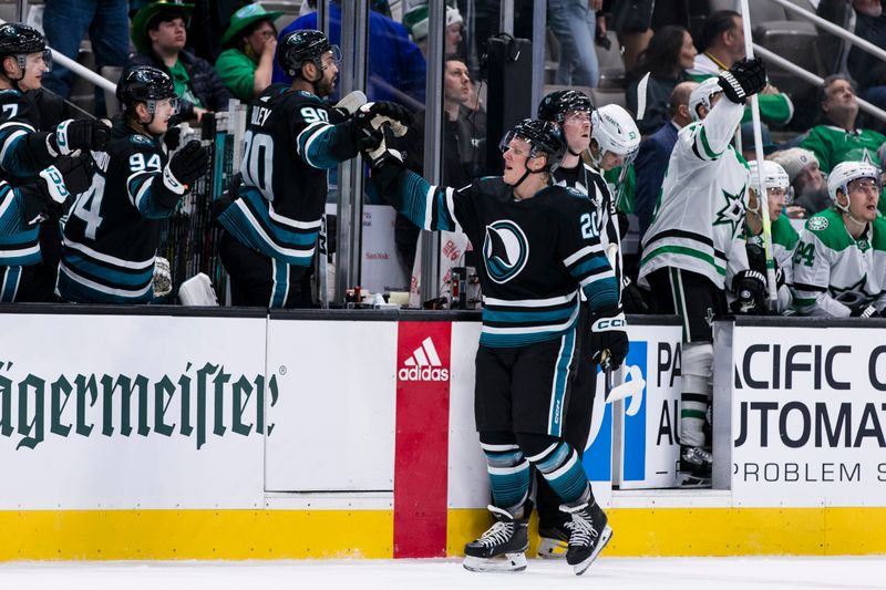 Mar 5, 2024; San Jose, California, USA; San Jose Sharks left wing Fabian Zetterlund (20) celebrates with the bench after scoring against the Dallas Stars during the first period at SAP Center at San Jose. Mandatory Credit: John Hefti-USA TODAY Sports