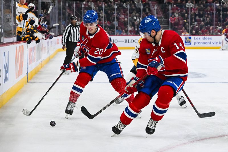 Dec 10, 2023; Montreal, Quebec, CAN; Montreal Canadiens left wing Juraj Slafkovsky (20) passes the puck to center Nick Suzuki (14) against the Nashville Predators during the third period at Bell Centre. Mandatory Credit: David Kirouac-USA TODAY Sports