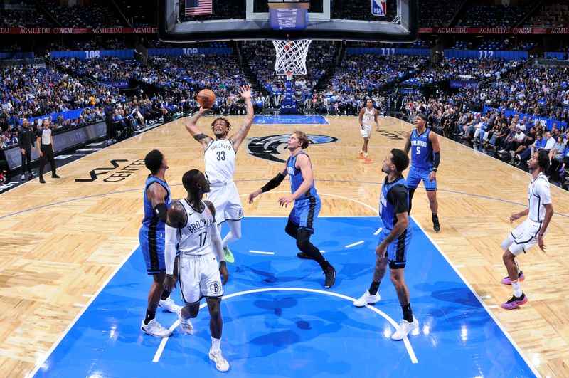 ORLANDO, FL - OCTOBER 25: Nicolas Claxton #33 of the Brooklyn Nets shoots the ball during the game against the Orlando Magic on October 25, 2024 at Kia Center in Orlando, Florida. NOTE TO USER: User expressly acknowledges and agrees that, by downloading and or using this photograph, User is consenting to the terms and conditions of the Getty Images License Agreement. Mandatory Copyright Notice: Copyright 2024 NBAE (Photo by Fernando Medina/NBAE via Getty Images)