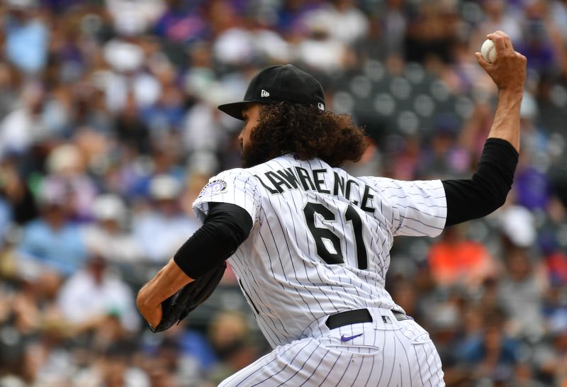 May 28, 2023; Denver, Colorado, USA; Colorado Rockies relief pitcher Justin Lawrence (61) delivers a pitch in the ninth inning as he gets the save against the New York Mets at Coors Field. Mandatory Credit: John Leyba-USA TODAY Sports