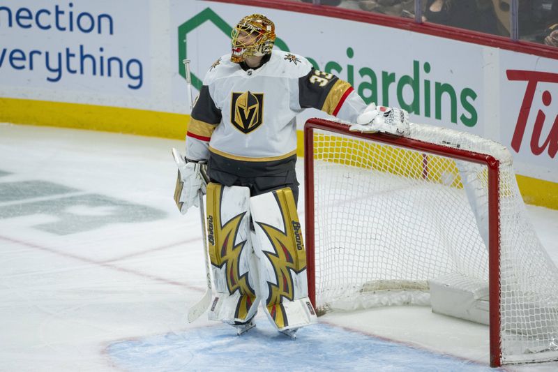 Jan 25, 2026; Ottawa, Ontario, CAN; Vegas Golden Knights goalie Adin Hill (33) reviews a play on the screen during a break in the third period against the Ottawa Senators at the Canadian Tire Centre. Mandatory Credit: Marc DesRosiers-IMAGN Images