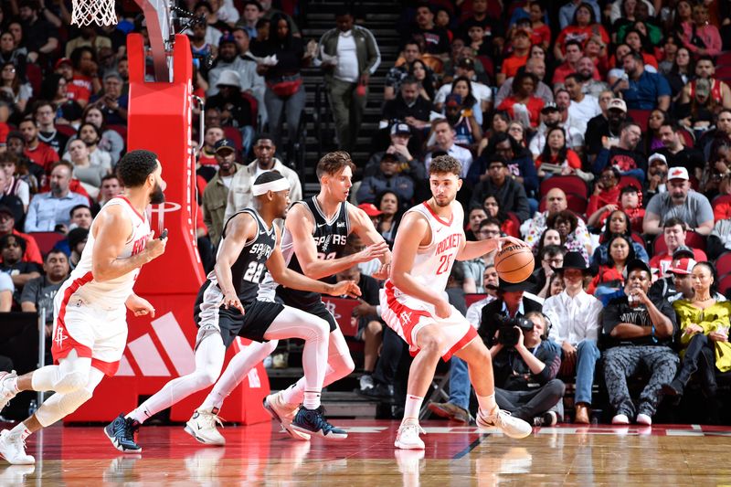 HOUSTON, TX - MARCH 5:  Alperen Sengun #28 of the Houston Rockets dribbles the ball during the game against the San Antonio Spurs on March 5, 2024 at the Toyota Center in Houston, Texas. NOTE TO USER: User expressly acknowledges and agrees that, by downloading and or using this photograph, User is consenting to the terms and conditions of the Getty Images License Agreement. Mandatory Copyright Notice: Copyright 2024 NBAE (Photo by Logan Riely/NBAE via Getty Images)