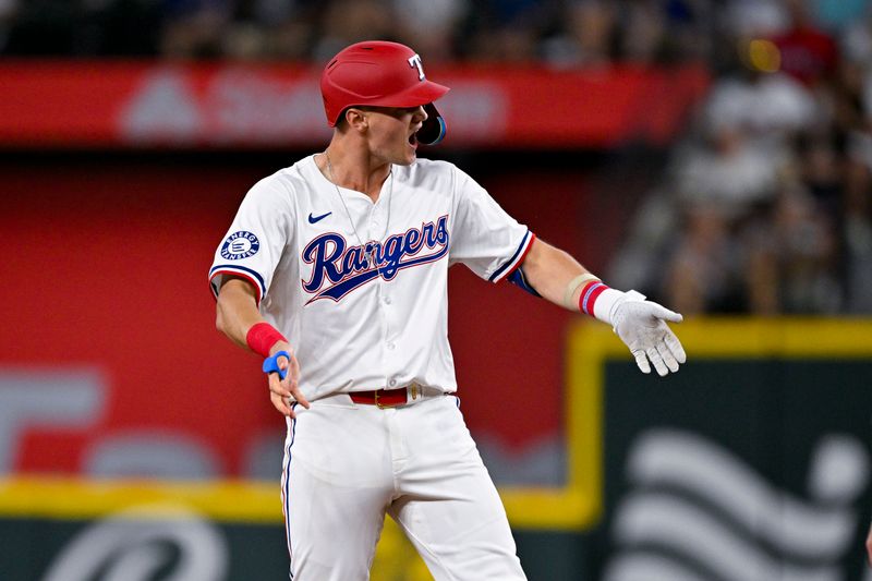 Aug 5, 2024; Arlington, Texas, USA; Texas Rangers third baseman Josh Jung (6) celebrates after he hits a double against the Houston Astros during the fourth inning at Globe Life Field. Mandatory Credit: Jerome Miron-USA TODAY Sports