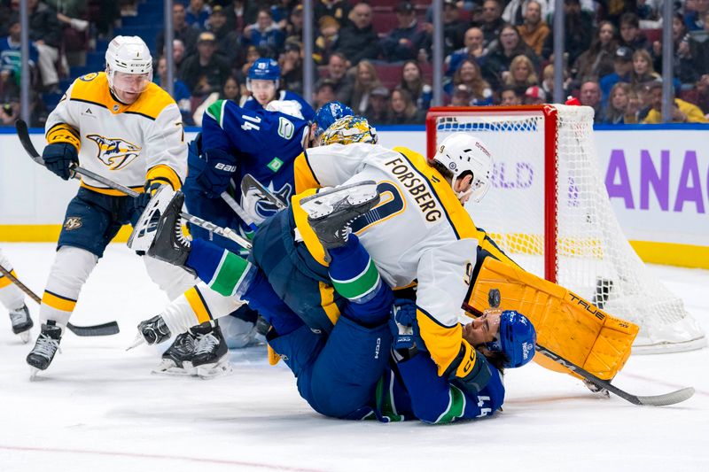 Nov 17, 2024; Vancouver, British Columbia, CAN; Nashville Predators forward Filip Forsberg (9) checks Vancouver Canucks forward Kiefer Sherwood (44) during the third period at Rogers Arena. Mandatory Credit: Bob Frid-Imagn Images