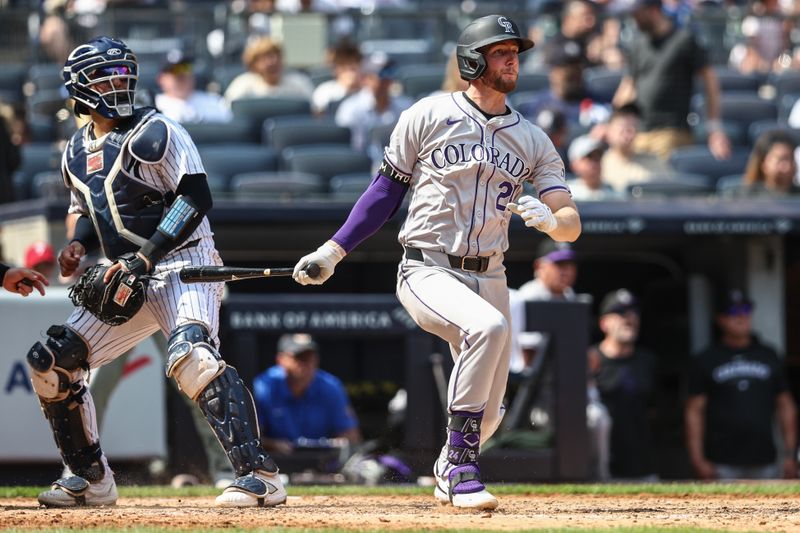 Aug 25, 2024; Bronx, New York, USA;  Colorado Rockies third baseman Ryan McMahon (24) hits an RBI double in the fifth inning against the New York Yankees at Yankee Stadium. Mandatory Credit: Wendell Cruz-USA TODAY Sports