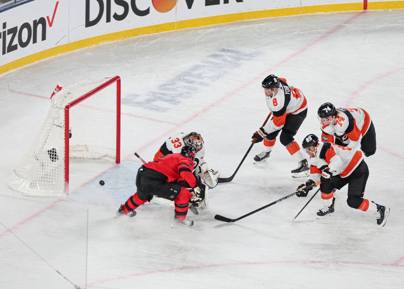 Feb 17, 2024; East Rutherford, New Jersey, USA; New Jersey Devils defenseman Brendan Smith (2) scores a goal past Philadelphia Flyers goaltender Samuel Ersson (33) in a Stadium Series ice hockey game at MetLife Stadium. Mandatory Credit: Vincent Carchietta-USA TODAY Sports