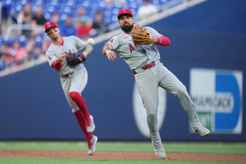 Apr 2, 2024; Miami, Florida, USA; Los Angeles Angels third baseman Anthony Rendon (6) throws out Miami Marlins first baseman Jake Burger (36) in the first inning at loan Depot Park. Mandatory Credit: Jim Rassol-USA TODAY Sports