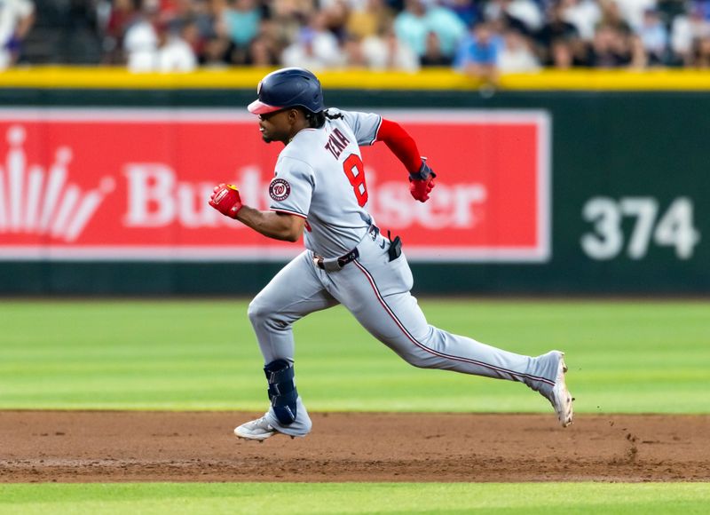May 30, 2025; Phoenix, Arizona, USA; Washington Nationals infielder Jose Tena hits a third inning triple against the Arizona Diamondbacks at Chase Field. Mandatory Credit: Mark J. Rebilas-Imagn Images