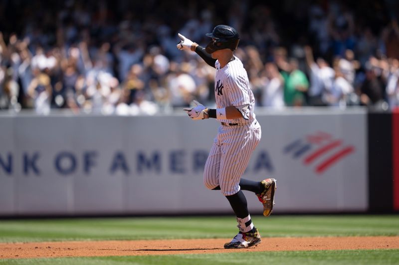 May 28, 2023; Bronx, New York, USA; New York Yankees right fielder Aaron Judge (99) reacts to hitting a home run against the San Diego Padres as he rounds the bases during the first inning at Yankee Stadium. Mandatory Credit: Gregory Fisher-USA TODAY Sports