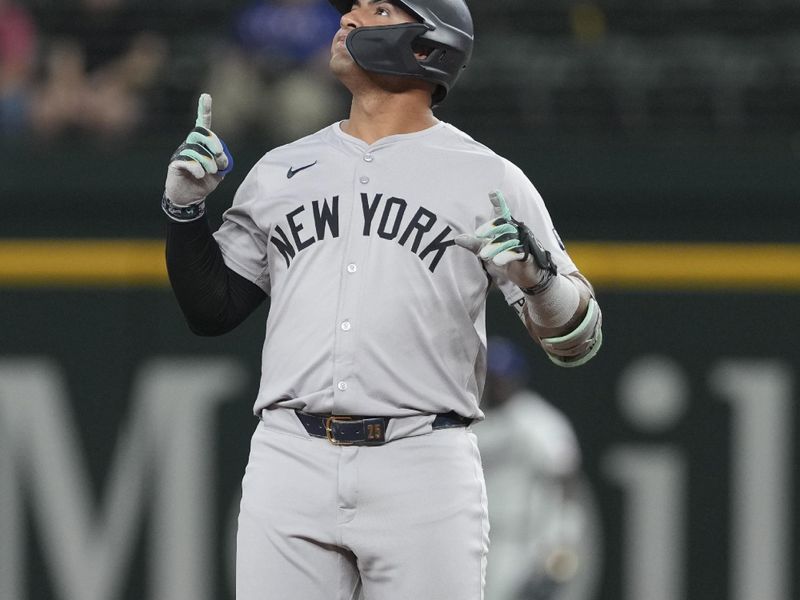 Sep 3, 2024; Arlington, Texas, USA; New York Yankees second baseman Gleyber Torres (25) gestures as he reaches second base on his double against the Texas Rangers during the third inning at Globe Life Field. Mandatory Credit: Jim Cowsert-Imagn Images