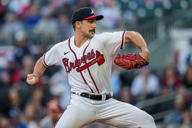 Apr 12, 2023; Cumberland, Georgia, USA; Atlanta Braves starting pitcher Spencer Strider (99) pitches against the Cincinnati Reds during the first inning at Truist Park. Mandatory Credit: Dale Zanine-USA TODAY Sports