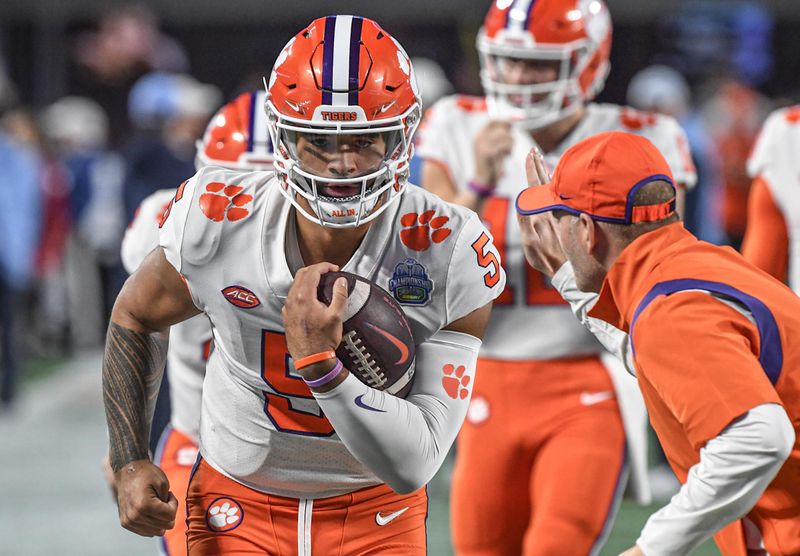 Dec 3, 2022; Charlotte, NC, USA; Clemson Tigers quarterback DJ Uiagalelei (5) warms up before the ACC Championship game against the North Carolina Tarheels at Bank of America Stadium. Mandatory Credit: Ken Ruinard-USA TODAY NETWORK