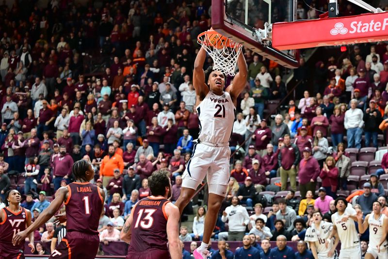 Feb 15, 2025; Blacksburg, Virginia, USA; Virginia Tech Hokies forward Ryan Jones Jr. (21) dunks the ball during the second half as Virginia Tech Hokies forward Ben Burnham (13) defends at Cassell Coliseum. Mandatory Credit: Brian Bishop-Imagn Images